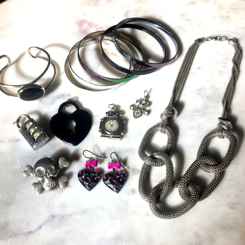 Lot of costume jewelry included are charms pendant necklace bracelets cuff & pin